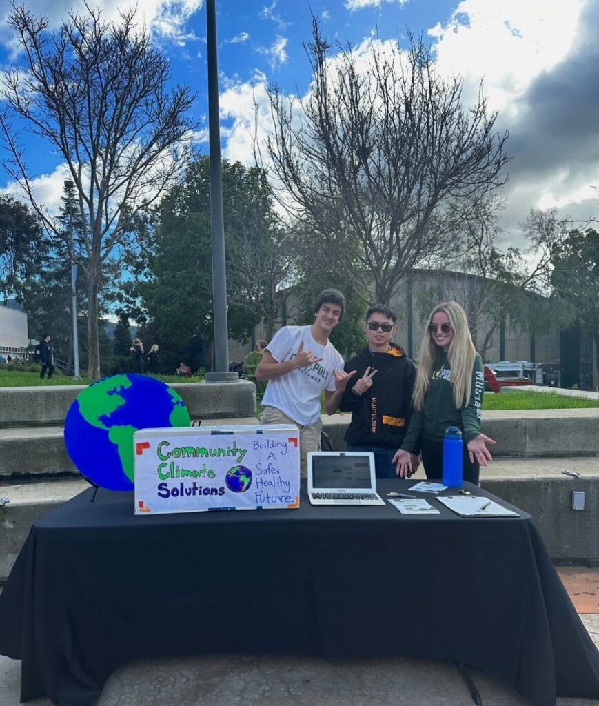 Young people promoting community climate solutions at a local event.