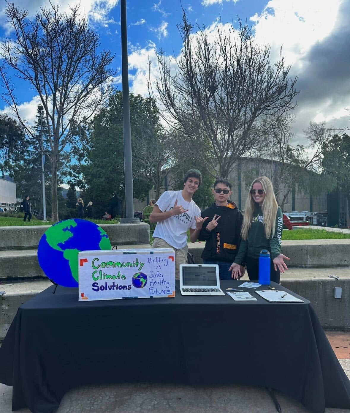 Young people promoting community climate solutions at a local event.